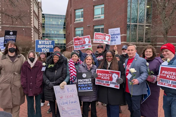 Senator Lea Webb, President Taliercio, CNYALF E-Board member Brendan McGovern, and other speakers pose after the March 6th Hands Off the Department of Education rally in Binghamton